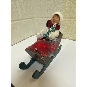 Byer’s Choice Caroler in Sled with tree and blanket